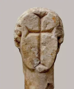A Hellenic or Roman marble head of a goddess statue, defaced with a Christian cross during the Late Antique period. The statue dates back to 2-1st century BC. Defaced during late Antiquity (2-7 century AD). Archaeological Museum of Samos, Greece