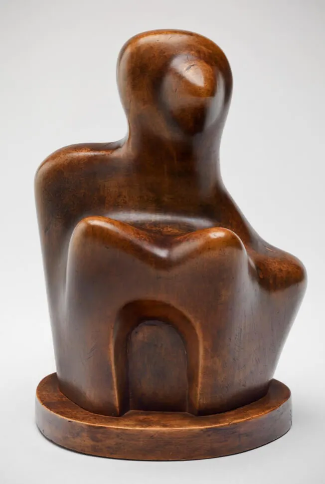 Figure’, a carved beechwood interpretation of a female form, 1931. © The Henry Moore Foundation/Tate.